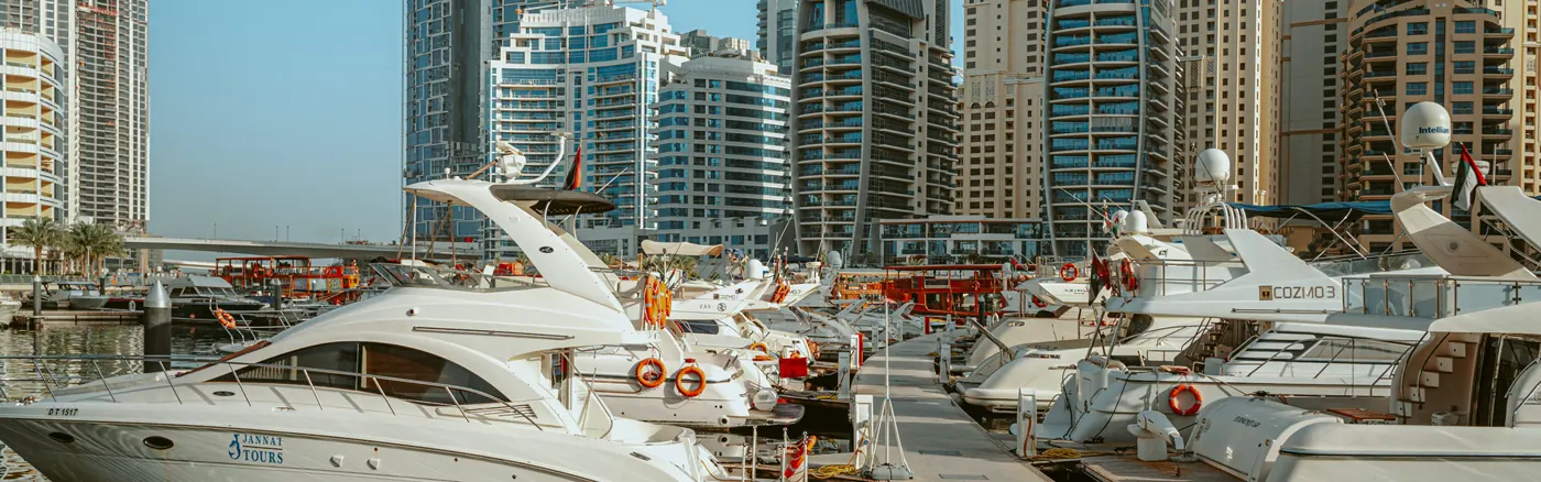 Dubai Marina skyline and waterfront under a blue sky